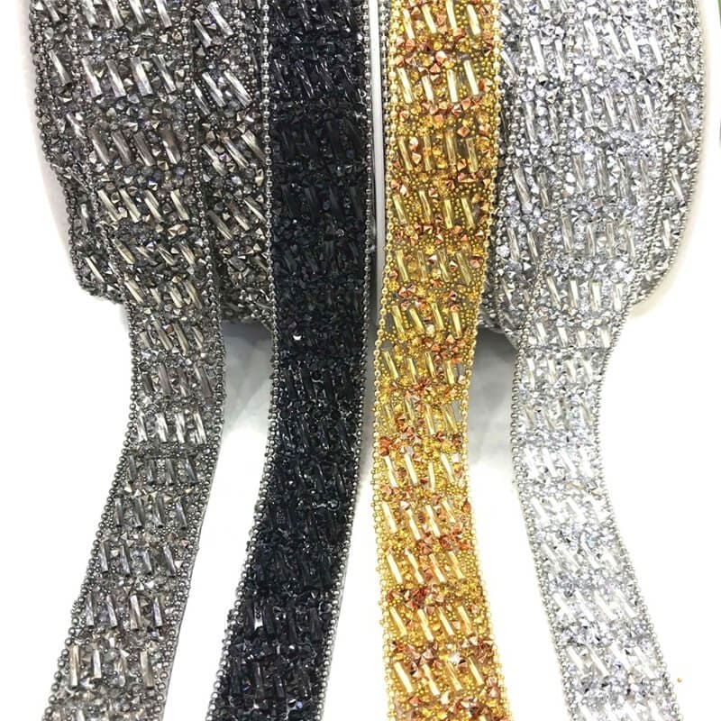 Dense iron on rhinestone trim with crystal stones in silver black and gold colors