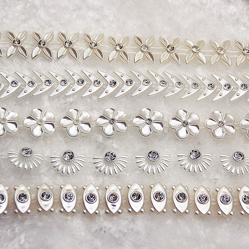 Plastic rhinestone banding trim with round crystal stones on white plastic base for garment decoration