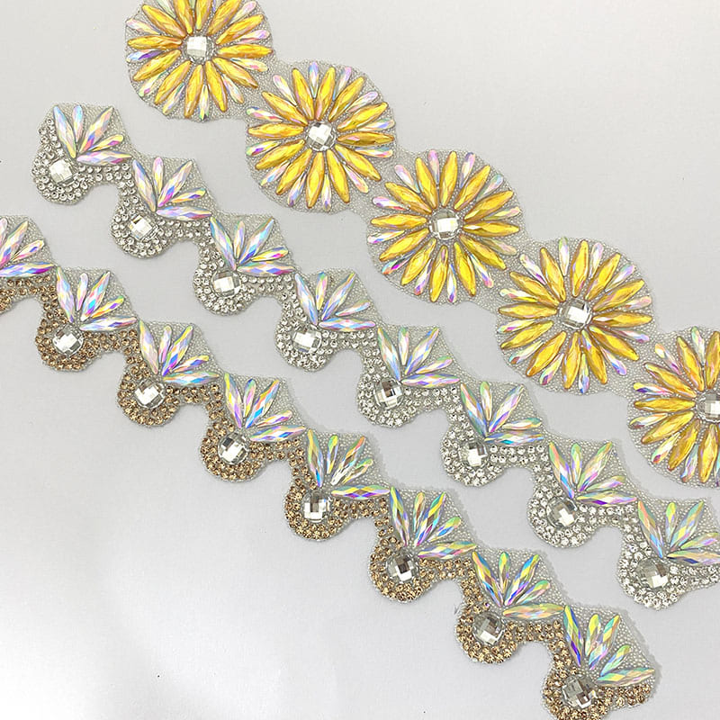 Floral shaped adhesive rhinestone trim with AB crystals and glitter elements for garment decoration